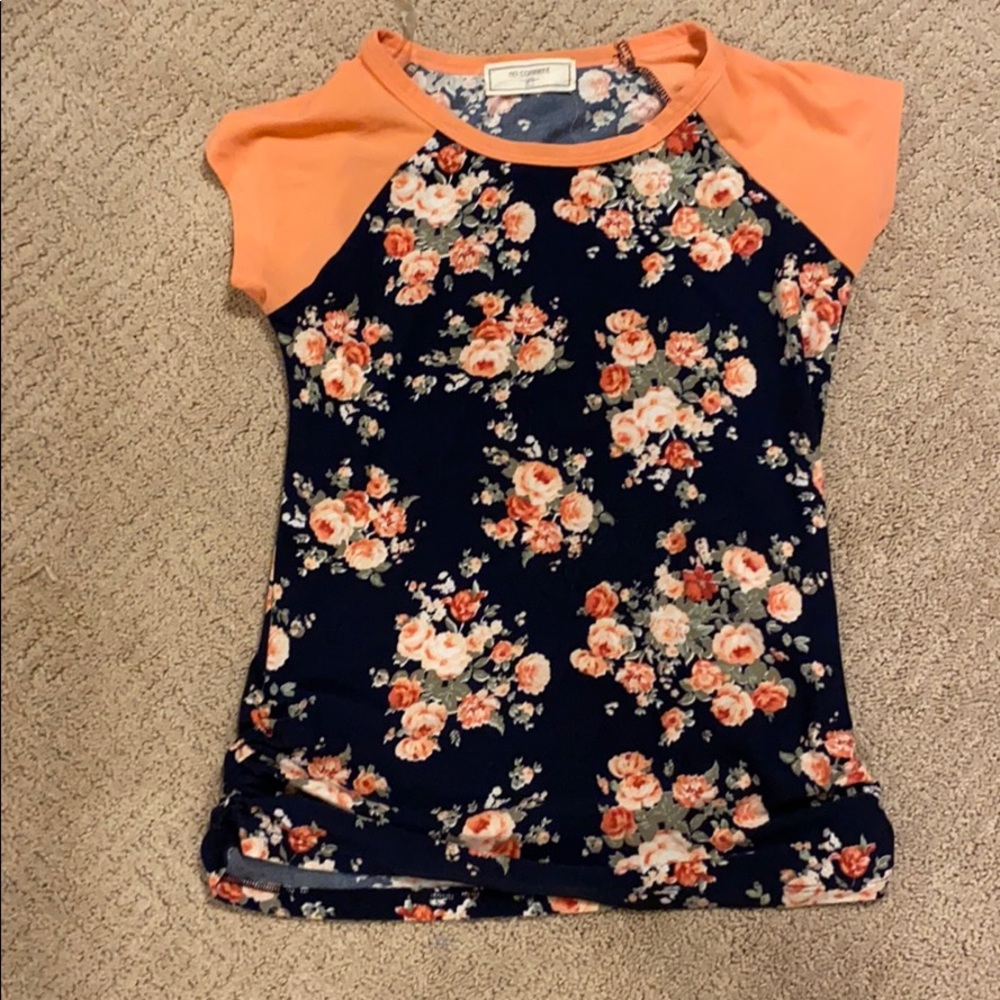I’m selling a floral short sleeve top.